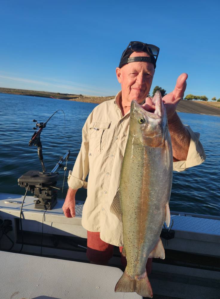 Brett Brady client holding a trophy trout